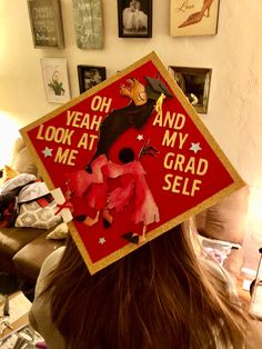 a woman wearing a graduation cap that says oh yeah and look at my grad self