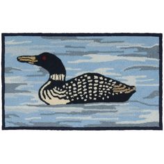 a rug with a black and white duck in the water on it's side