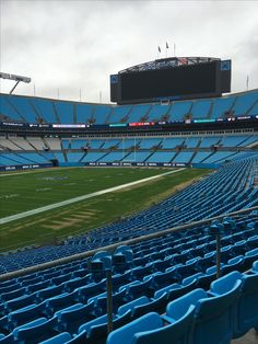 empty stadium seats in the middle of a football field