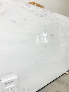 a large white marble slab in a warehouse