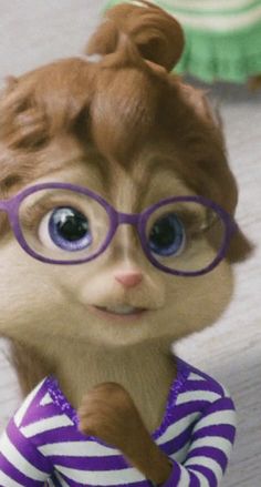 a close up of a stuffed animal wearing glasses and a striped shirt with an eye patch