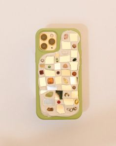 a cell phone case that has been made out of glass and other things on it