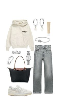 a woman's outfit with white hoodie, grey jeans and black handbag