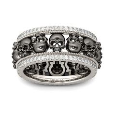 two skull rings with diamonds in the middle