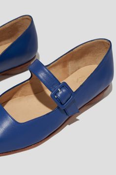 The Eugenia Flat is a modern interpretation of the classic mary jane flat featuring a square toe, angular topline and oval-shaped heel. This pair is crafted from vibrant blue kidskin leather and a matching buckle. Who it’s for: The woman who is looking for mood-enhancing emotional pieces that defy reason, yet work perfectly with her style and sense of expression. Kidskin upper and undyed vegetable-tanned leather lining. Leather sole with stacked leather heel measuring 18mm. Handmade in Argentina Classic Blue Closed Toe Flats, Blue Classic Closed Toe Flats, Classic Blue Flats With Removable Insole, Blue Leather Closed Toe Flats, Elegant Blue Leather Ballet Flats, Blue Leather Pointed Toe Flats, Leather Mary Jane Flats With Square Toe, Blue Leather Low Heel Flats, Blue Closed Toe Mary Janes