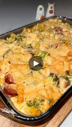 a casserole dish with broccoli, bacon and cheese