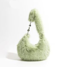 Discover Your New Favorite Accessory Step into a world of style and comfort with our Chic Fuzzy Faux Fur Half Moon Shoulder Bag. Designed for the modern woman who values both fashion and functionality, this trendy plush crossbody purse is a must-have addition to your accessory collection. Whether you're running errands, heading to a brunch, or enjoying a night out, this bag complements every occasion with its versatile design. Exceptional Features This shoulder bag showcases a unique half-moon shape that not only stands out but also provides ample space for your essentials. The soft faux fur material lends a luxurious feel, while the synthetic leather lining ensures durability. The bag's single strap design makes it easy to carry, offering both shoulder and crossbody wearing options. Plus, Moon Shoulder Bag, Faux Fur Material, Moon Shapes, Minimalist Interior, Crossbody Purse, Half Moon, Modern Woman, Running Errands, Purses Crossbody