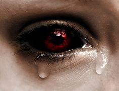 an eye with blood on it and water dripping from the iris's tears