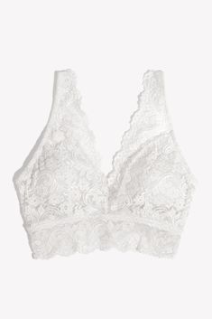 Signature Lace Deep V Bralette 2 Pack SA1372Effortless style. Versatile and comfortable, this bralette top features all-over signature lace with soft, removable cups for padding when you want them and a natural shape when you don't. Extra wide front camisole straps, and a gorgeous deep v plunge in the front are perfect for peeking through you favorite tops. Wear it around the house, wear it to brunch, wear it absolutely everywhere. 2 pack Soft, removable cups All-over signature lace Extra wide front camisole straps Soft, stretchy silhouette Plunge front and back necklines Wide lace bottom band Fitters comments: "wear under a button down for a cami bra look" Fit tips: if you are in between sizes, go a size down Fabric content: 94% Nylon, 6% Spandex  As a Women Owned company, making you feel House Wear, Lace Bralette Top, Cami Bra, White Bralette, Cotton Bras, Bralette Top, Plus Size Bra, Swim Skirt, Bralette Tops