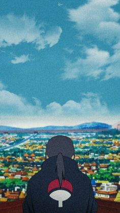 the back of a person's head in front of a large cityscape