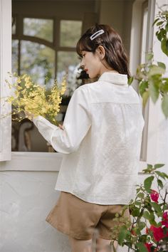 Long sleeve button up shirt in a textured fabric with a peter pan collar with scallop lace trims and embroidered delicate florals along the front. S: 13.5" across shoulders, 36" chest, 22.5" lengthM: 14" across shoulders, 37.5" chest, 22.5" lengthL: 14.5" across shoulders, 39" chest, 23" length Long Sleeve Button Up Shirt, Lace Trims, Shoe Gifts, Scalloped Lace, Overall Dress, Pan Collar, Textured Fabric, Peter Pan Collar, Sweater Blouse