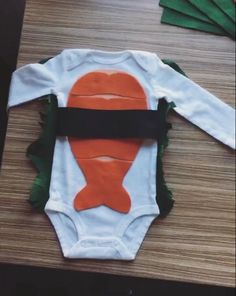 a baby bodysuit made to look like a fish