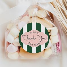 a bag filled with cookies and marshmallows on top of a table