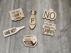 wooden magnets with funny sayings on them sitting next to each other and one has a tie