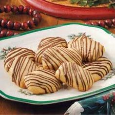 some cookies are sitting on a white plate