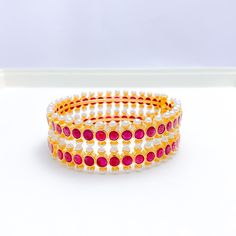 Elegant Pearl + Ruby 22k Gold Bangles Red Ruby Bangle For Festive Occasions, Red Ruby Temple Jewelry Bangle, Traditional Ruby Bangle, Festive Ruby Round Bangle, Festive Round Ruby Bangle, 22k Gold Bangles, Ruby Bangles, Pearl Bangle, Gold Stone