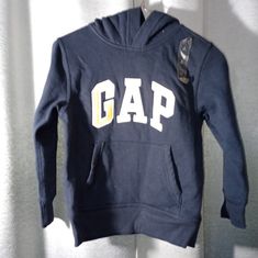 New Gap Pullover Hoodie, Navy Blue, Yellow Letters, Hood, Long Sleeves, Pocket Across Stomach, Nwt, Cotton And Polyester. Kid's Size Small 6-7. Hoodie Gap, Gap Sweatshirt, Gap Hoodie, Purple Hoodie, Yellow Hoodie, Gap Jacket, Toddler Hoodie, Kids Coats, Kids Sweater