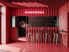 a red bar with stools in front of it and neon lights on the ceiling