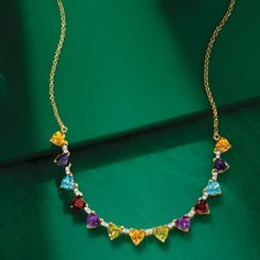 Ross-Simons - 13.50ct t. w. Heart-Shaped Multi-Gemstone Necklace Over Sterling. 18". Our vibrant necklace brings beauty to any ensemble. 13.50 ct. tot. gem wt. heart-shaped citrine, iolite, Swiss blue topaz, garnet, amethyst and peridot gems brightly glow, with white topaz rounds sparkling in between. Finely crafted in polished 18kt yellow gold over sterling silver and stationed on a rolo chain with a 2" extender. Lobster clasp, heart-shaped multi-gemstone necklace. Garnet birthstones are the pe Elegant Multicolor Heart Cut Jewelry, Multicolor Heart Cut Multi-stone Jewelry, Elegant Multicolor Valentine's Day Jewelry, Fine Jewelry Multi-stone For Valentine's Day, Gold Heart Jewelry With Gemstone Accents, Fine Multi-stone Jewelry For Valentine's Day, Elegant Multi-stone Jewelry For Valentine's Day, Multicolor Heart-shaped Gemstone Necklace, Fine Jewelry Multi-stone Necklace For Anniversary