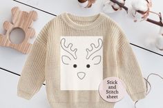 a knitted sweater with a reindeer face on it