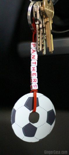 several keys are attached to a soccer ball keychain with the word partners written on it