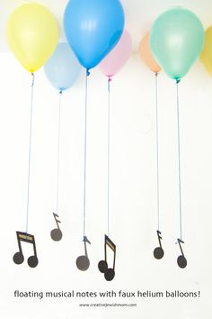 five balloons with musical notes attached to them