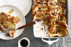 a casserole dish on a plate with a fork next to the casserole