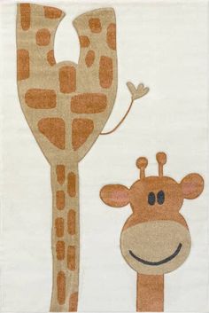 a giraffe standing next to a tall tree on top of a white ground