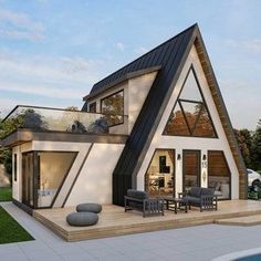 a house with a pool in front of it and an outdoor dining area next to it