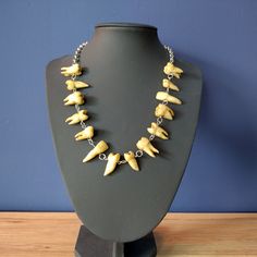 This weird necklace is made of 14 resin human teeth copies on a silver (look) chain. NOTE: This is not real silver. Every tooth is painted by hand, and looks very realistic. Necklace is 50 cm. (20 inch) and is made from stainless steel (old silver look) chain and has a lobster clip. (nickel free) This necklace is not waterproof, don't shower while wearing this jewelry or swim with it. Tooth Necklace Human, Weird Necklace, Teeth Necklace, Human Teeth, Teeth Jewelry, Tooth Necklace, Ap Art, Tooth Fairy, Favorite Jewelry