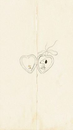 an open book with two hearts drawn on it