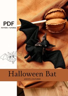 an image of halloween bat decoration on a wooden table with text overlaying it