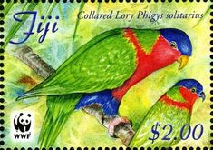 a postage stamp with two colorful birds on it