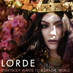 a woman wearing a tiara with flowers in the background and text that reads, lorde everybody wants to rule the world