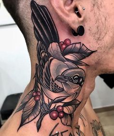 a man with a bird tattoo on his neck and behind the ear is a flower