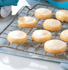 there are many lemon cookies on the cooling rack