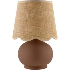 a brown table lamp with a beige shade on the top and bottom part of it