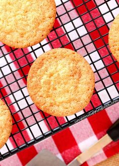 four cookies sitting on top of a cooling rack