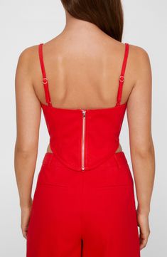 Internal boning and supportive seams lend structure to this subtly cropped corset top. 9 1/2" length (size 8) Exclusive retailer Exposed back-zip closure Deep V-neck Adjustable straps 100% polyester Hand wash, line dry Imported Cropped Top With Built-in Bra And Fitted Bodice, Fitted Cropped Crop Top With Built-in Bra, Fitted Party Crop Top With Zipper Closure, Fitted Crop Top With Zipper For Party, Fitted Crop Top With Zipper Closure For Party, Spring Sleeveless Corset With Zipper Closure, Sleeveless Spring Corset With Zipper Closure, Fitted Corset With Zipper For Spring, Fitted Zipper Closure Crop Top For Summer