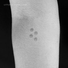 small paw prints tattoo on the left thigh by littletattoos com, via flickon