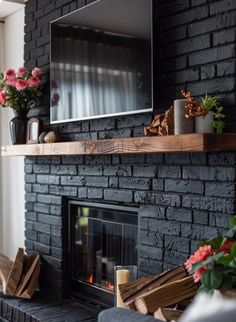 a living room with a fireplace and tv mounted on the wall above it's mantle