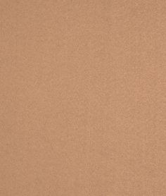 a beige fabric textured with small dots