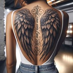 the back of a woman's body with angel wings on her upper and lower back