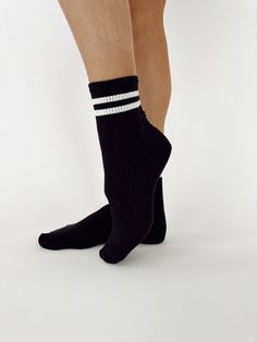 Our Varsity Socks are knit with ribbed and striped styling for a comfortable, casual, and athleisure look. With an ankle-length design for a trendy finish, these varsity socks bring the perfect combination of fashion and function. Trendy Sports Socks For Spring, Striped Stretch Socks For Winter, Stretch Striped Socks For Winter, Winter Striped Stretch Socks, Casual Striped Stretch Socks, Casual Stretch Striped Socks, Winter Sporty Socks With Ribbed Cuffs, Sporty Winter Socks With Ribbed Cuffs, Trendy Black Sports Socks