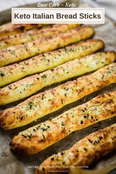 baked bread sticks are lined up on a baking sheet with the words low carb keto italian bread sticks