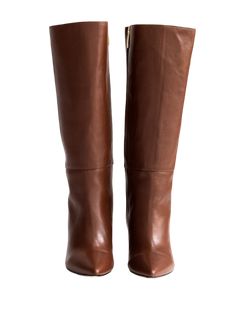 A Bestseller! The Celina Boot by Alma Caso is the quintessential tall boot. Featuring soft brown leather, a pointy toe, chunky heel and interior zipper, you'll want to get this boot in every color! 4 millimeter padding for a bit more comfort. Comes with dust bag. Runs small. Order one full size up. DETAILS 100% LeatherHandmade in MexicoTops measure 13.5 inches3.5 inch heel Brown Snip Toe Boots For Office, Brown Leather Pointed Toe Wedge Boots, Brown Pointed Toe Heeled Boots For Work, Brown Pointed Toe Mid-calf Boots For Work, Brown Snip Toe Heeled Boots For Work, Brown Calf Leather Knee-high Boots With Almond Toe, Brown Calf Leather Boots With Pointed Toe, Brown Knee-high Boots With Pointed Toe, Brown Calf Leather Knee-high Boots With Pointed Toe