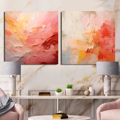 two paintings on the wall in a living room with pink chairs and a coffee table