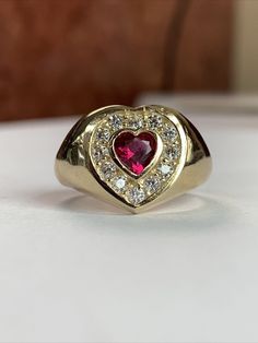 "This vintage-style heart ring is meticulously crafted from solid 14K yellow gold, adorned with exquisite cubic zirconia stones. With a weight of 4.6 grams, it bears the hallmark \"14k\" on the inside, confirming its authenticity as solid gold." Gold Rings Heart, Gold Heart Ring, Stone Heart, Cute Jewelry, Rings Statement, Cubic Zirconia, Heart Ring, Solid Gold, Statement Rings