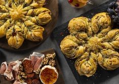 an assortment of pastries and fruit on plates