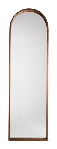 an arched mirror is shown against a white background and has wood trim around the edges